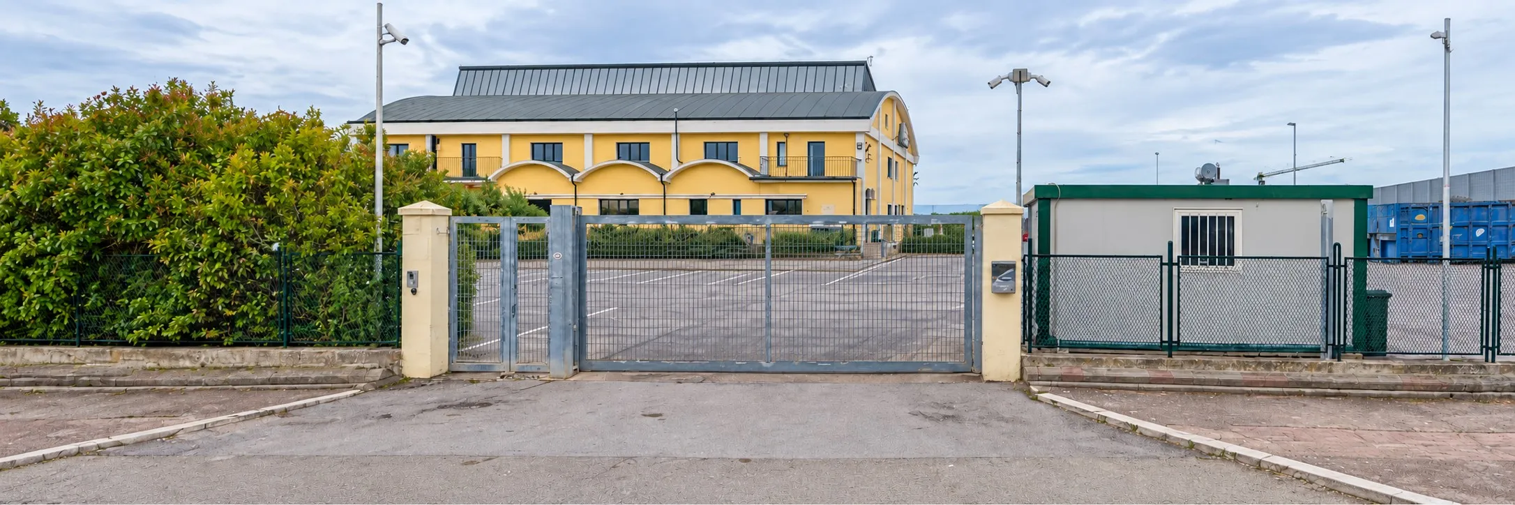 Amon Energy's headquarters in Castelluccio dei Sauri: the office building beyond the entrance gate